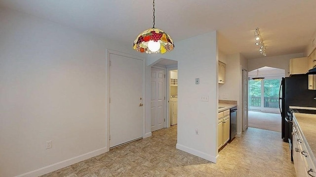 33 Cobblestone Ln Unit 33, Worcester, MA 01606 - kitchen with arched walkways, dishwasher, light flooring, and light countertops