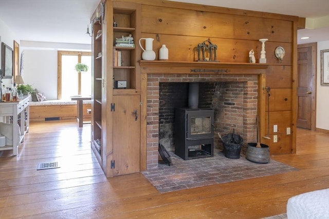 697 Rte 197, Woodstock, CT 06281 - living room with hardwood / wood-style flooring and a wood stove