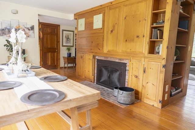 697 Rte 197, Woodstock, CT 06281 - living room with light wood-style flooring and a brick fireplace