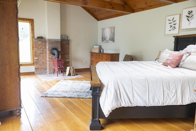 697 Rte 197, Woodstock, CT 06281 - bedroom with hardwood / wood-style flooring, a wood stove, and wood ceiling