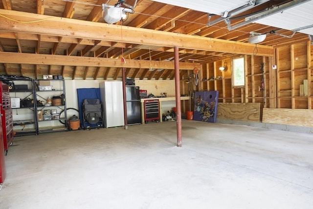 697 Rte 197, Woodstock, CT 06281 - garage featuring freestanding refrigerator and a garage door opener