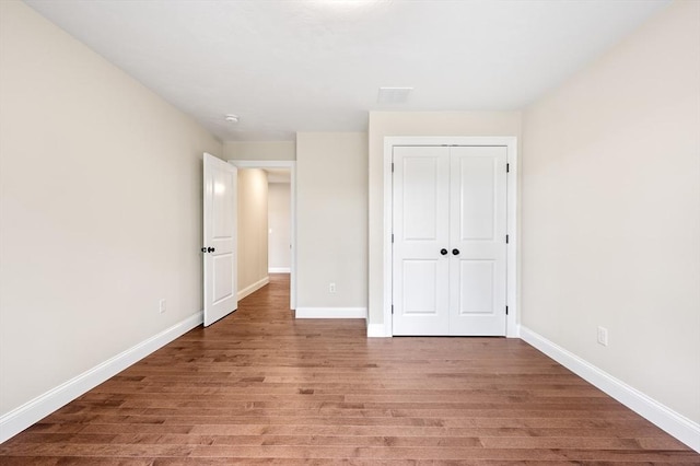 59A Mount Ave, Worcester, MA 01606 - unfurnished bedroom featuring light wood-type flooring, baseboards, and a closet