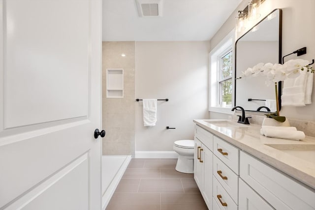 59A Mount Ave, Worcester, MA 01606 - full bath featuring double vanity, toilet, baseboards, tile patterned floors, and a shower