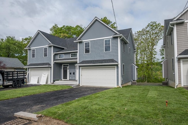 59A Mount Ave, Worcester, MA 01606 - traditional home featuring asphalt driveway, a front lawn, roof with shingles, an attached garage, and central AC unit