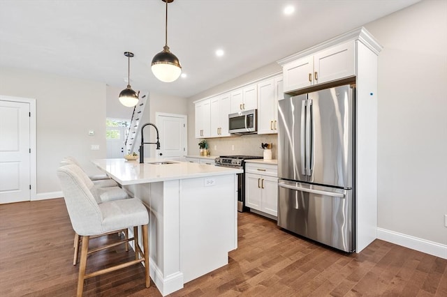 59A Mount Ave, Worcester, MA 01606 - kitchen with appliances with stainless steel finishes, a sink, a kitchen island with sink, dark wood finished floors, and recessed lighting