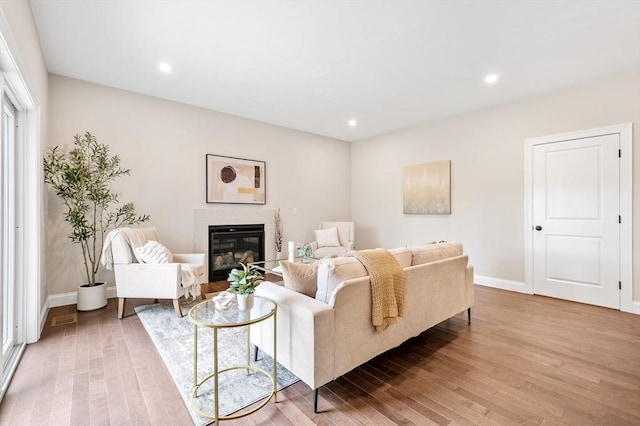 59A Mount Ave, Worcester, MA 01606 - living area with light wood-type flooring, a glass covered fireplace, baseboards, and recessed lighting