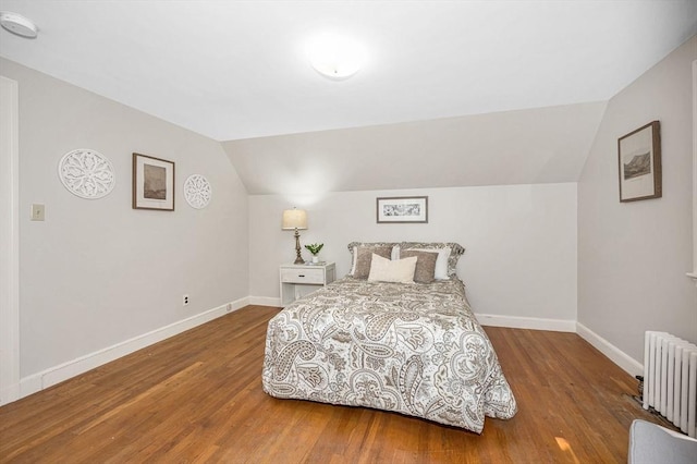 15 Eustis Ave, Wakefield, MA 01880 - bedroom featuring radiator heating unit, vaulted ceiling, wood finished floors, and baseboards