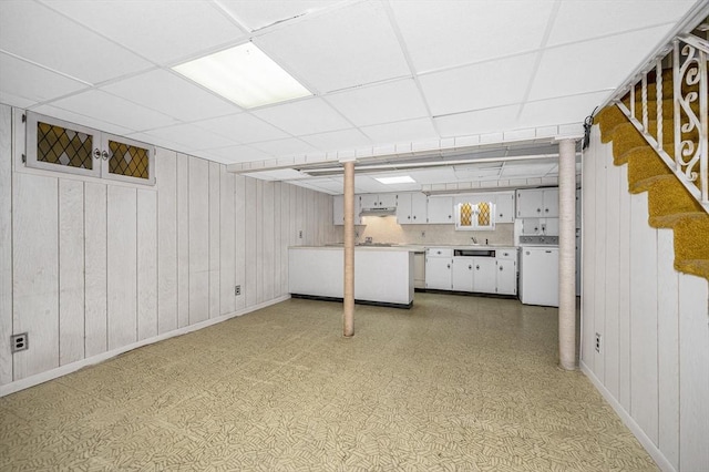 15 Eustis Ave, Wakefield, MA 01880 - finished basement featuring independent washer and dryer, a paneled ceiling, a sink, baseboards, and wood walls