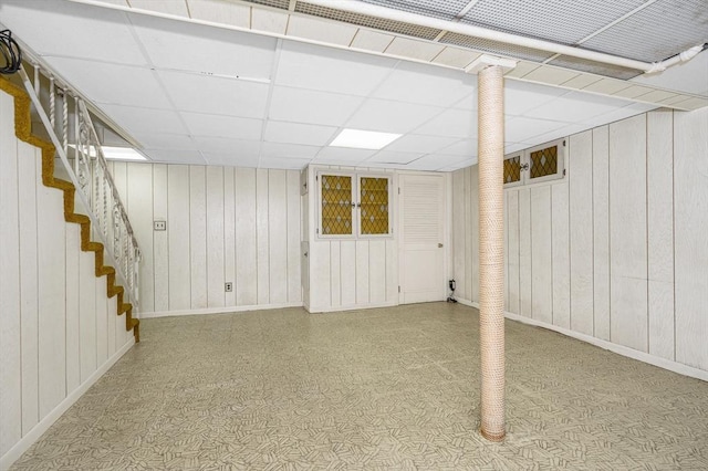 15 Eustis Ave, Wakefield, MA 01880 - finished basement featuring baseboards, a paneled ceiling, wood walls, and stairway