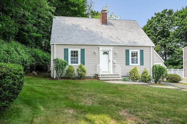 15 Eustis Ave, Wakefield, MA 01880 - cape cod home with a chimney, roof with shingles, a front lawn, and entry steps