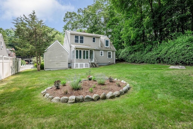 15 Eustis Ave, Wakefield, MA 01880 - rear view of house featuring entry steps