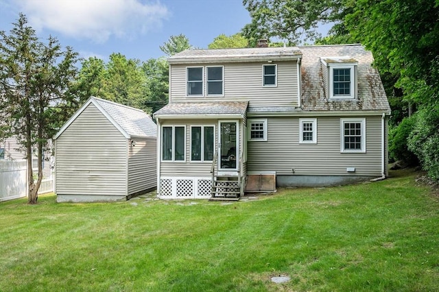15 Eustis Ave, Wakefield, MA 01880 - rear view of property featuring a yard and a chimney