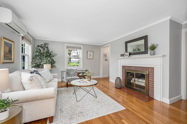15 Eustis Ave, Wakefield, MA 01880 - living room with a wall mounted air conditioner, healthy amount of natural light, wood finished floors, and crown molding