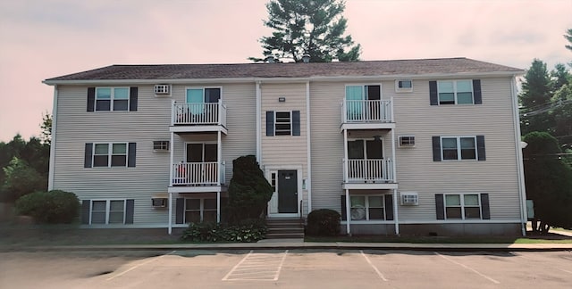 view of outdoor building at dusk