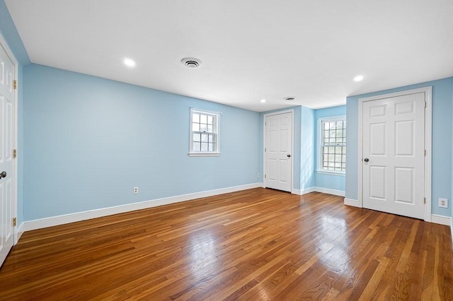 unfurnished bedroom with wood-type flooring