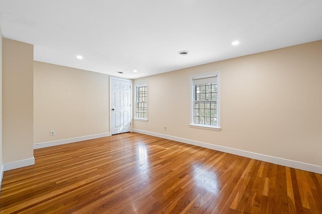 spare room featuring hardwood / wood-style floors