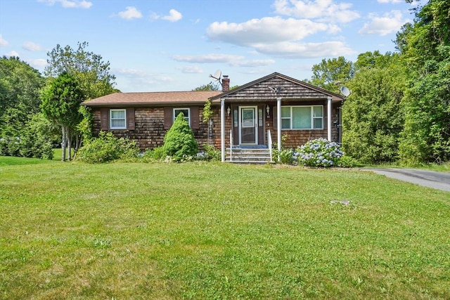92 Benoit St, Westport, MA 02790 - view of front facade featuring a front yard and a chimney