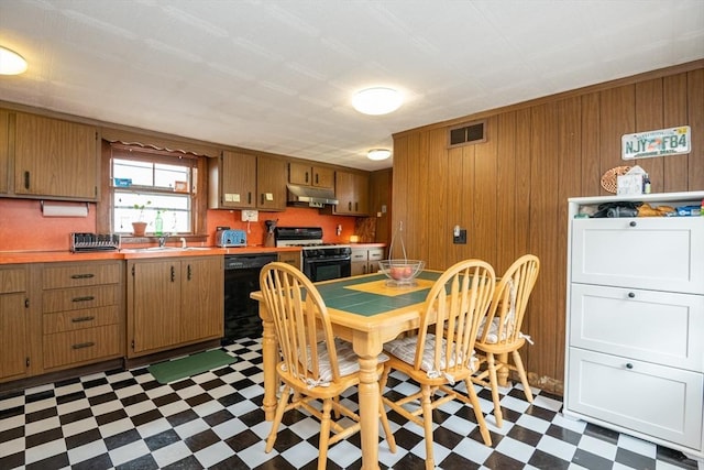 30 Everett St, Woburn, MA 01801 - dining area with dark flooring and wood walls