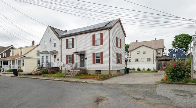 30 Everett St, Woburn, MA 01801 - view of front facade with solar panels and a residential view