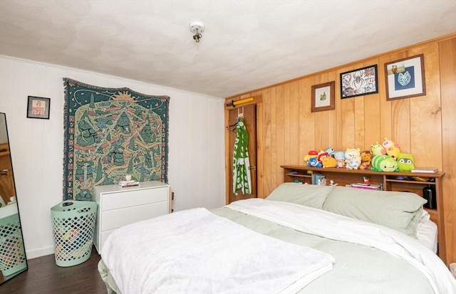 30 Everett St, Woburn, MA 01801 - bedroom with dark wood-style floors, wood walls, and baseboards