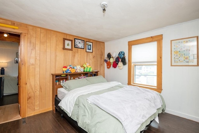 30 Everett St, Woburn, MA 01801 - bedroom featuring wood finished floors, baseboards, and wood walls