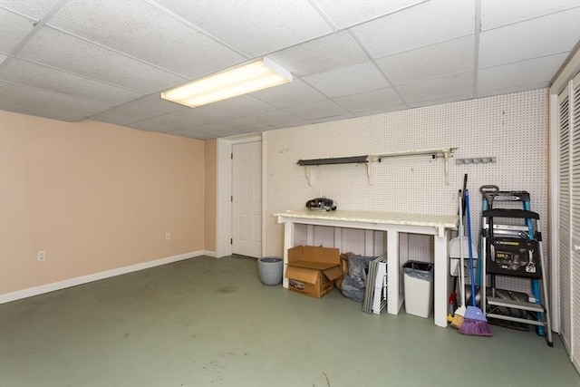 29 Benjamin Landing Ln Unit 29, Franklin, MA 02038 - finished below grade area with baseboards, a paneled ceiling, and a workshop area