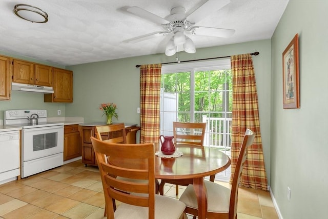 29 Benjamin Landing Ln Unit 29, Franklin, MA 02038 - kitchen featuring white range with electric stovetop, under cabinet range hood, light countertops, light tile patterned floors, and a ceiling fan