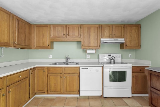 29 Benjamin Landing Ln Unit 29, Franklin, MA 02038 - kitchen with white appliances, a sink, under cabinet range hood, brown cabinetry, and light countertops