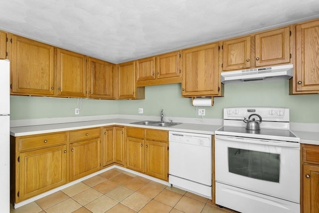 29 Benjamin Landing Ln Unit 29, Franklin, MA 02038 - kitchen with white appliances, under cabinet range hood, a sink, light countertops, and light tile patterned floors