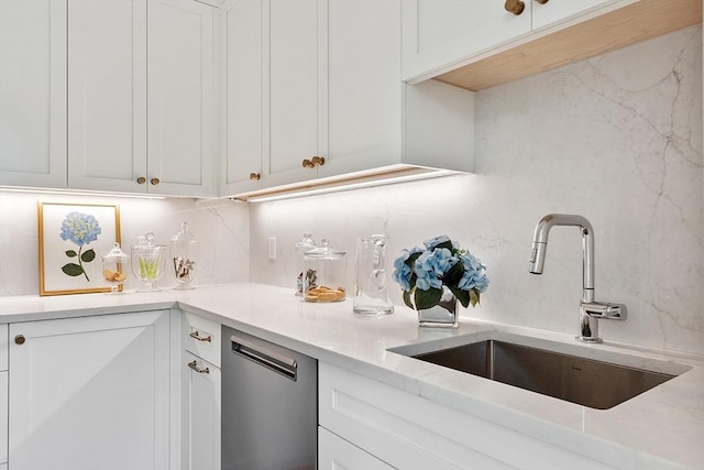 1 Beech Tree Ln, Lexington, MA 02421 - kitchen featuring a sink, backsplash, and white cabinetry