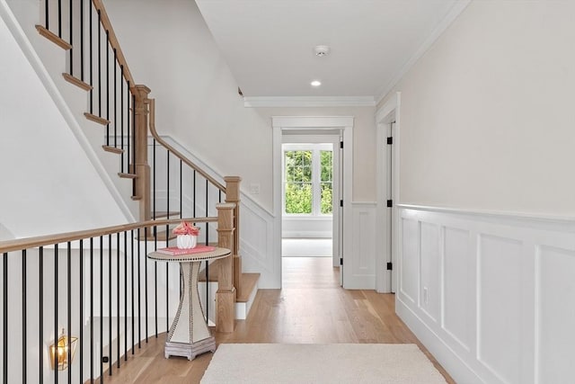 1 Beech Tree Ln, Lexington, MA 02421 - hall featuring light wood-style flooring, wainscoting, ornamental molding, a decorative wall, and recessed lighting