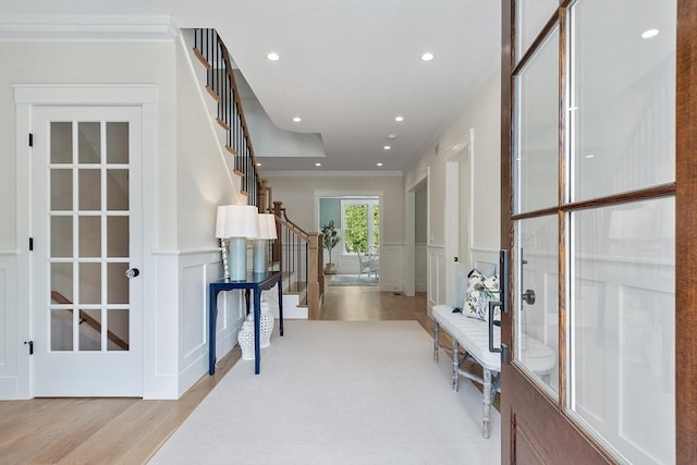 1 Beech Tree Ln, Lexington, MA 02421 - corridor with ornamental molding, a decorative wall, light wood-style flooring, a wainscoted wall, and recessed lighting