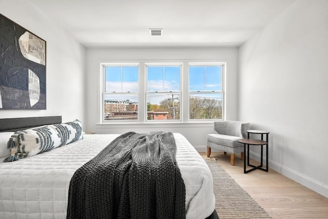 bedroom with light hardwood / wood-style flooring