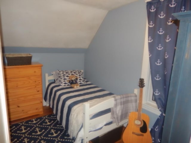 bedroom with vaulted ceiling