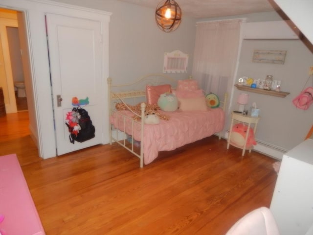 bedroom featuring wood finished floors