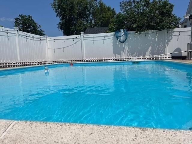 view of pool featuring a fenced in pool and a fenced backyard