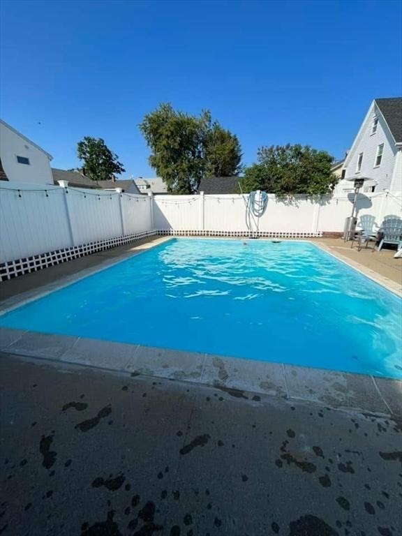 view of pool featuring a fenced in pool and a fenced backyard