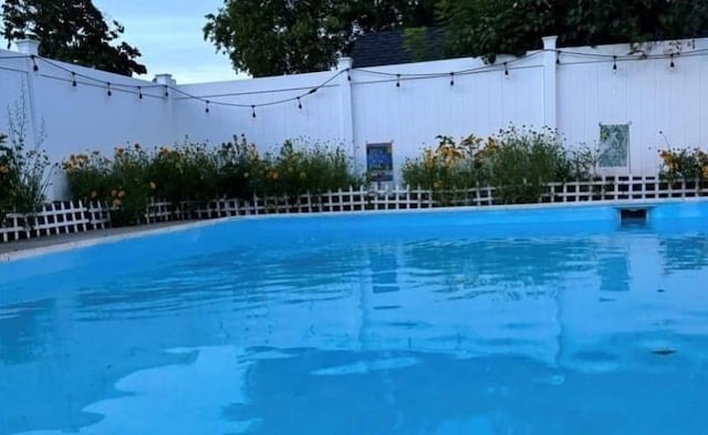 view of pool with fence