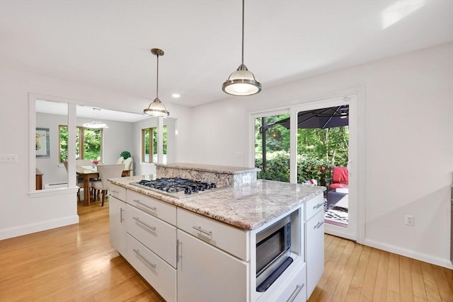 24 Azalea Way, Belchertown, MA 01007 - kitchen featuring stainless steel appliances, light wood-style floors, healthy amount of natural light, white cabinetry, and recessed lighting