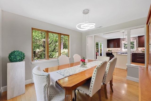 24 Azalea Way, Belchertown, MA 01007 - dining space featuring a chandelier and light wood-type flooring