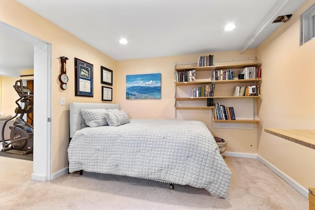 carpeted bedroom featuring baseboards and recessed lighting