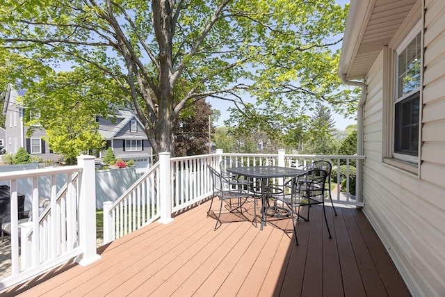 wooden terrace featuring outdoor dining space