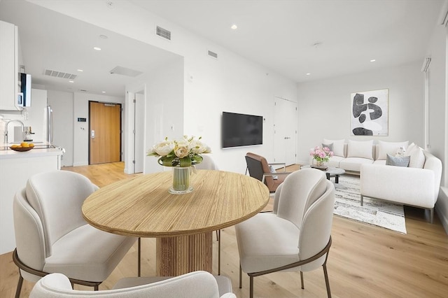 2149 Washington St Unit 601, Boston, MA 02119 - dining area featuring light wood-style floors and recessed lighting