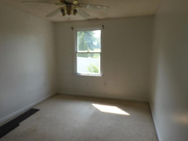 12C Oliver St Unit 12C, Haverhill, MA 01832 - empty room featuring healthy amount of natural light, light colored carpet, a ceiling fan, and baseboards