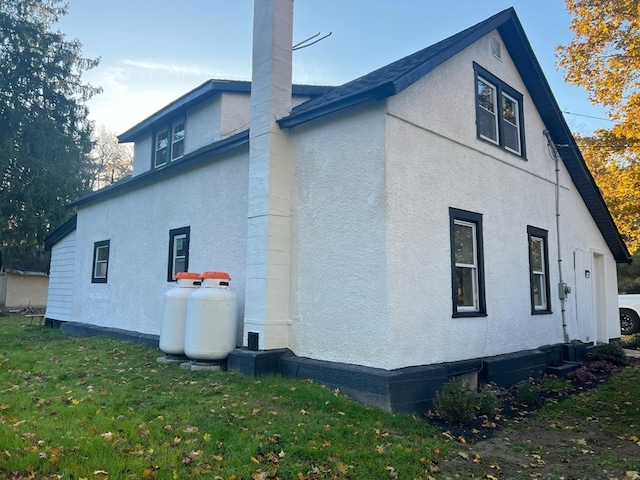 view of property exterior featuring a yard