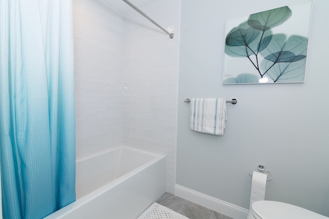 bathroom with shower / tub combo and toilet