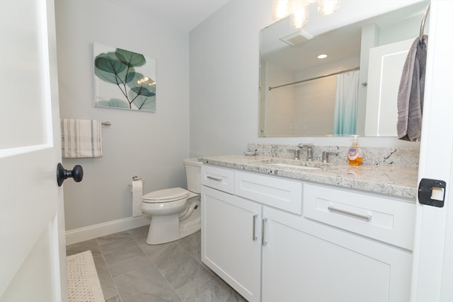 bathroom featuring tile patterned flooring, vanity, toilet, and a shower with curtain