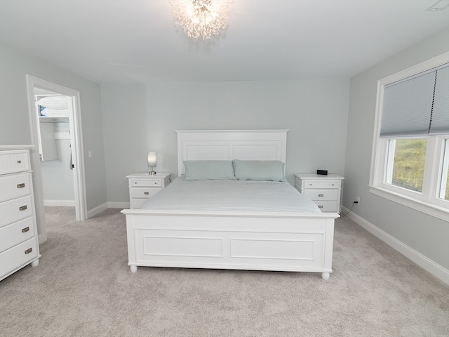 carpeted bedroom featuring a closet and a walk in closet