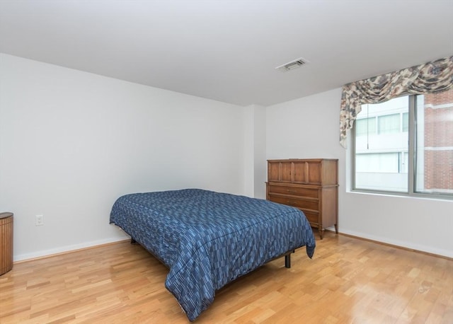 173 Oak Unit 208W, Newton, MA 02464 - bedroom with light wood finished floors and baseboards
