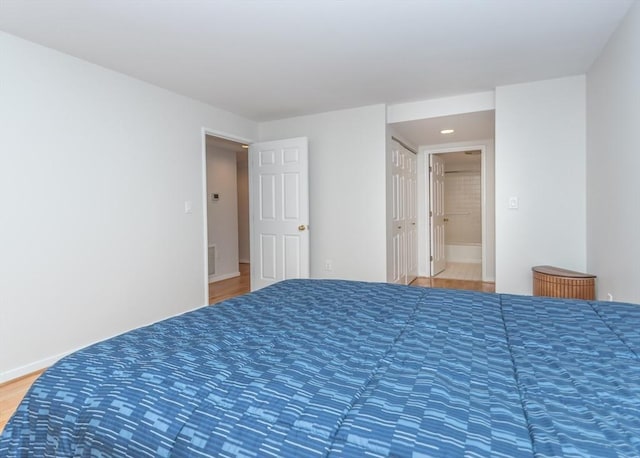 173 Oak Unit 208W, Newton, MA 02464 - bedroom featuring light wood-type flooring, ensuite bathroom, and recessed lighting